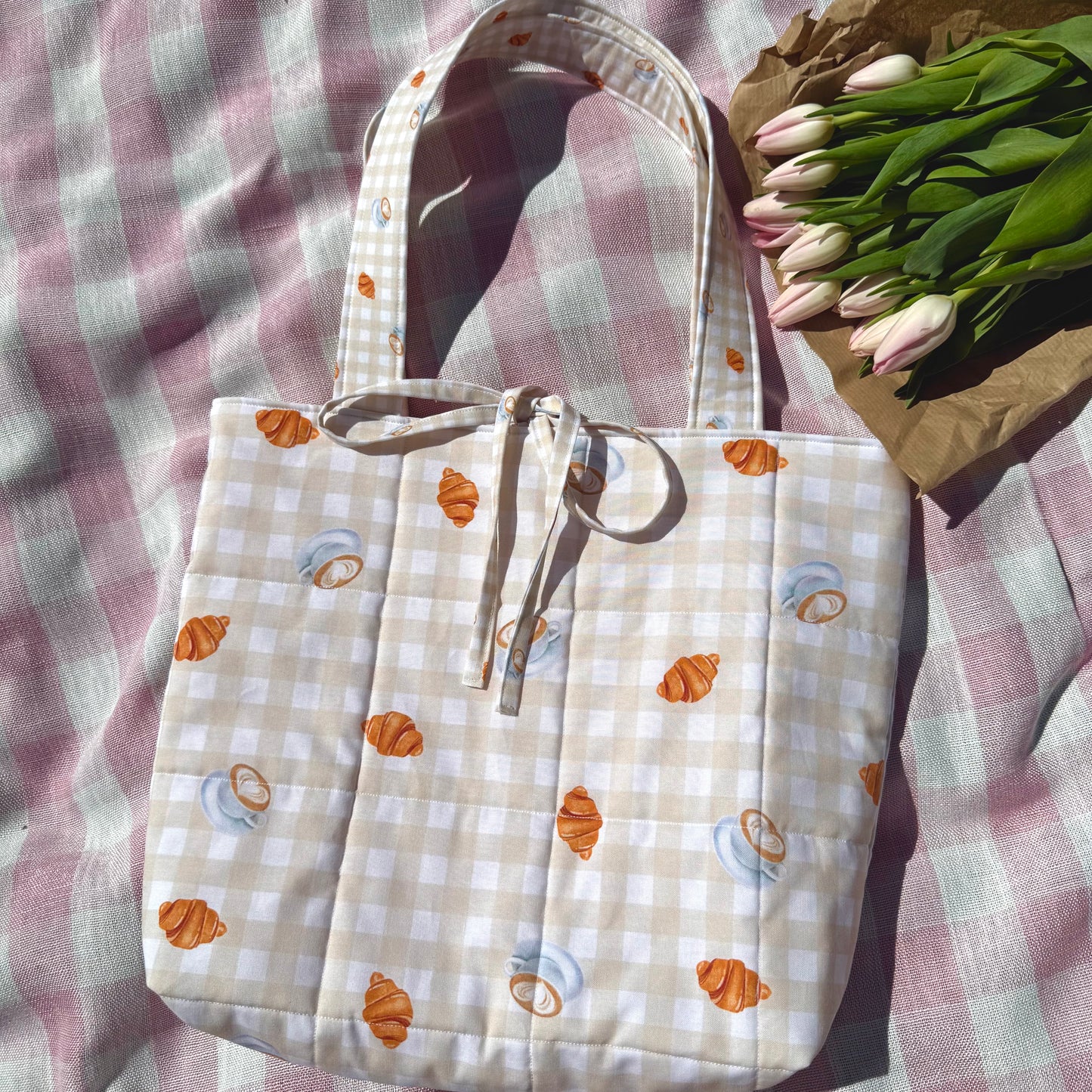 Tote bag with pastry pattern on a checkered fabric background
