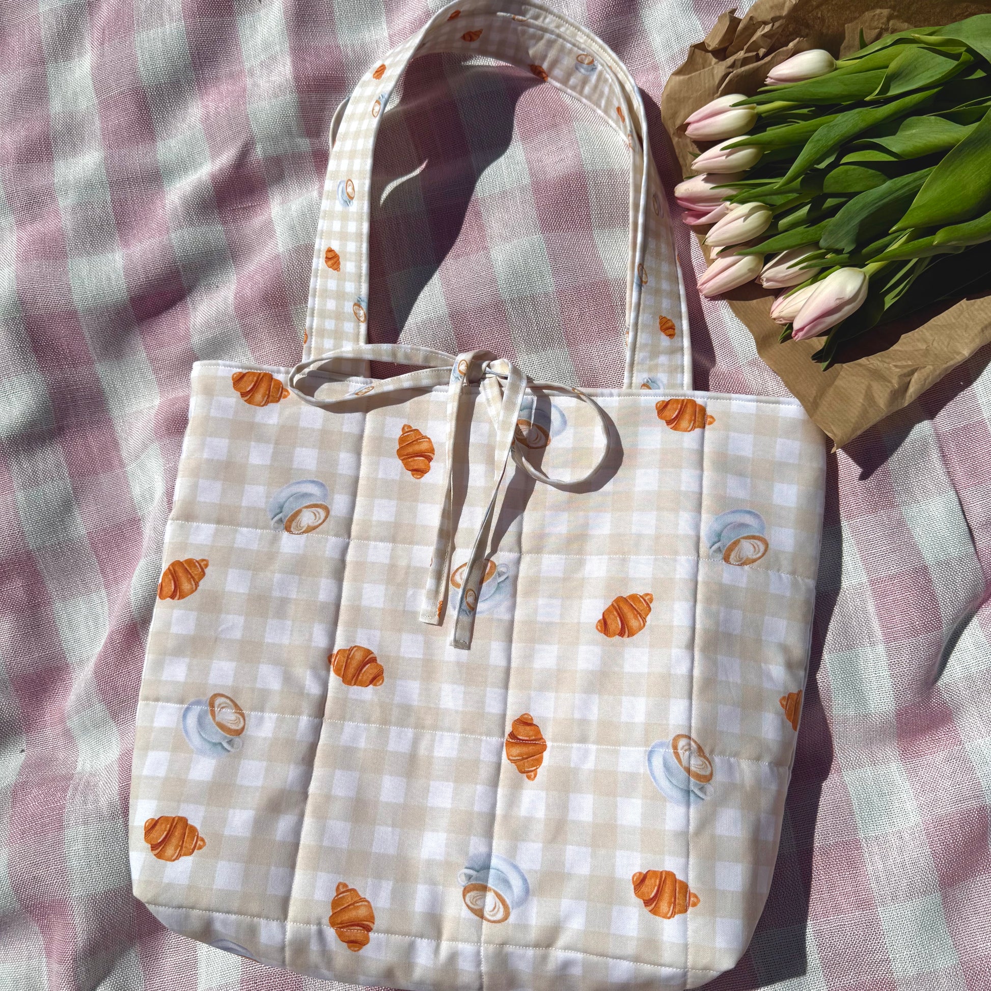 Tote bag with pastry pattern on a checkered fabric background